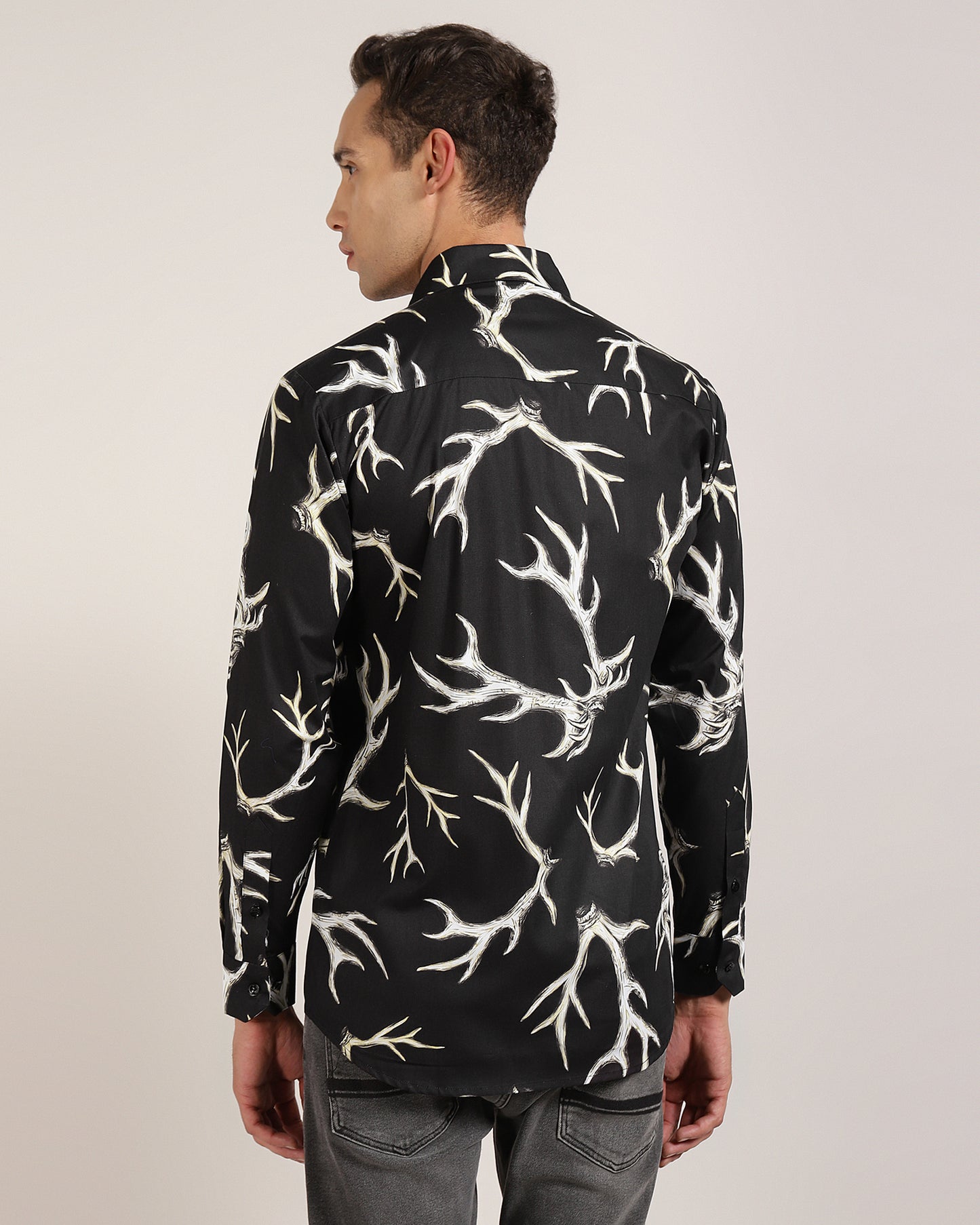 A close-up of the black abstract print on a shirt