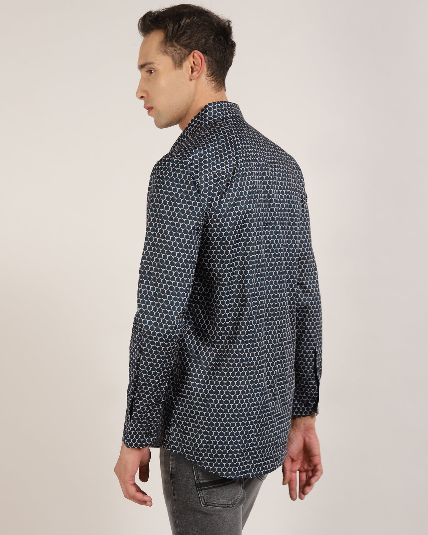 A man looking dapper in a blue and grey geometric shirt by Monsui