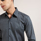 Make a statement in this blue and grey geometric printed shirt from Monsui.