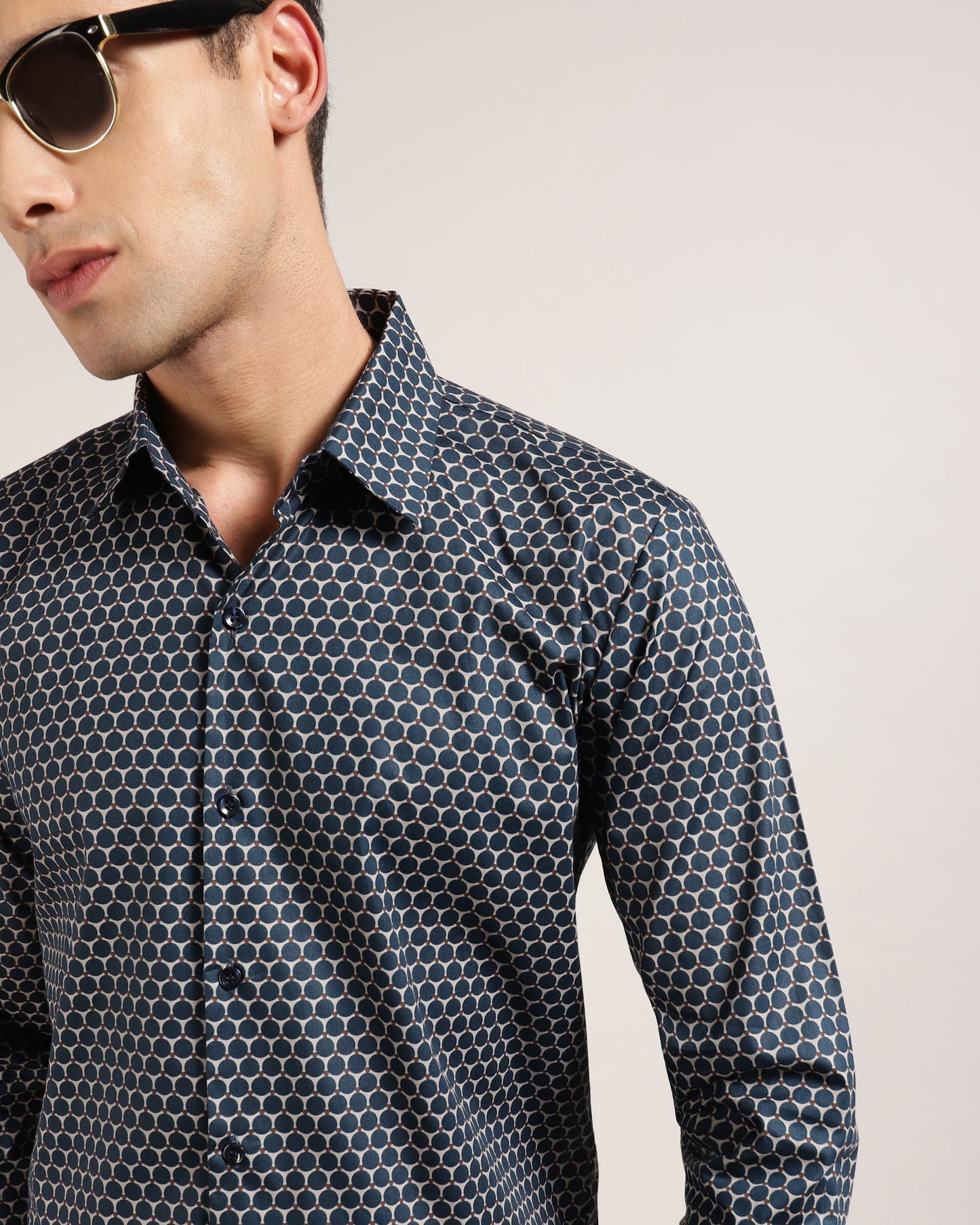 Make a statement in this blue and grey geometric printed shirt from Monsui.