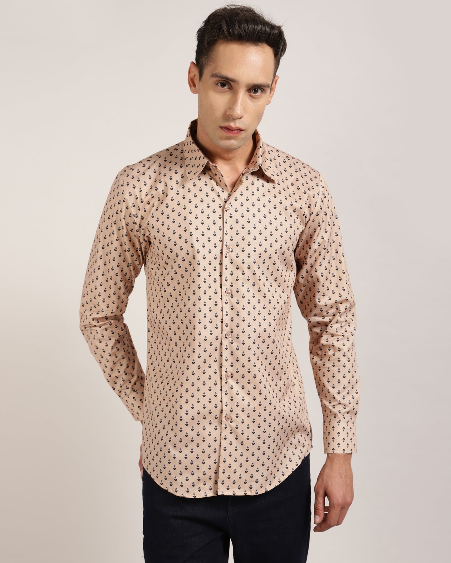 A man wearing a beige geometric printed 100% cotton shirt