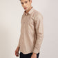 A front view of a beige geometric printed 100% cotton shirt