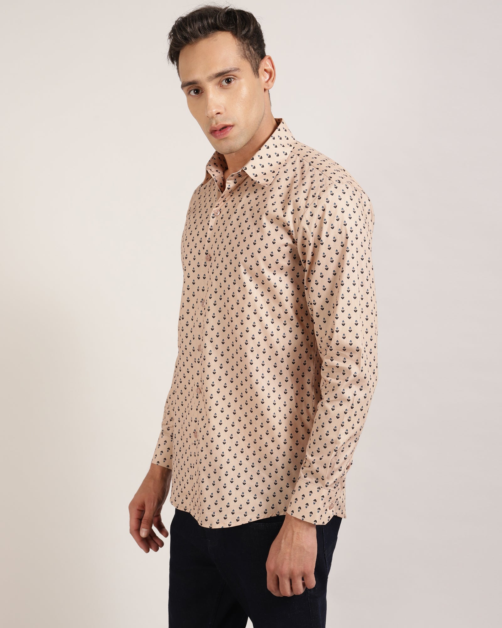 A front view of a beige geometric printed 100% cotton shirt