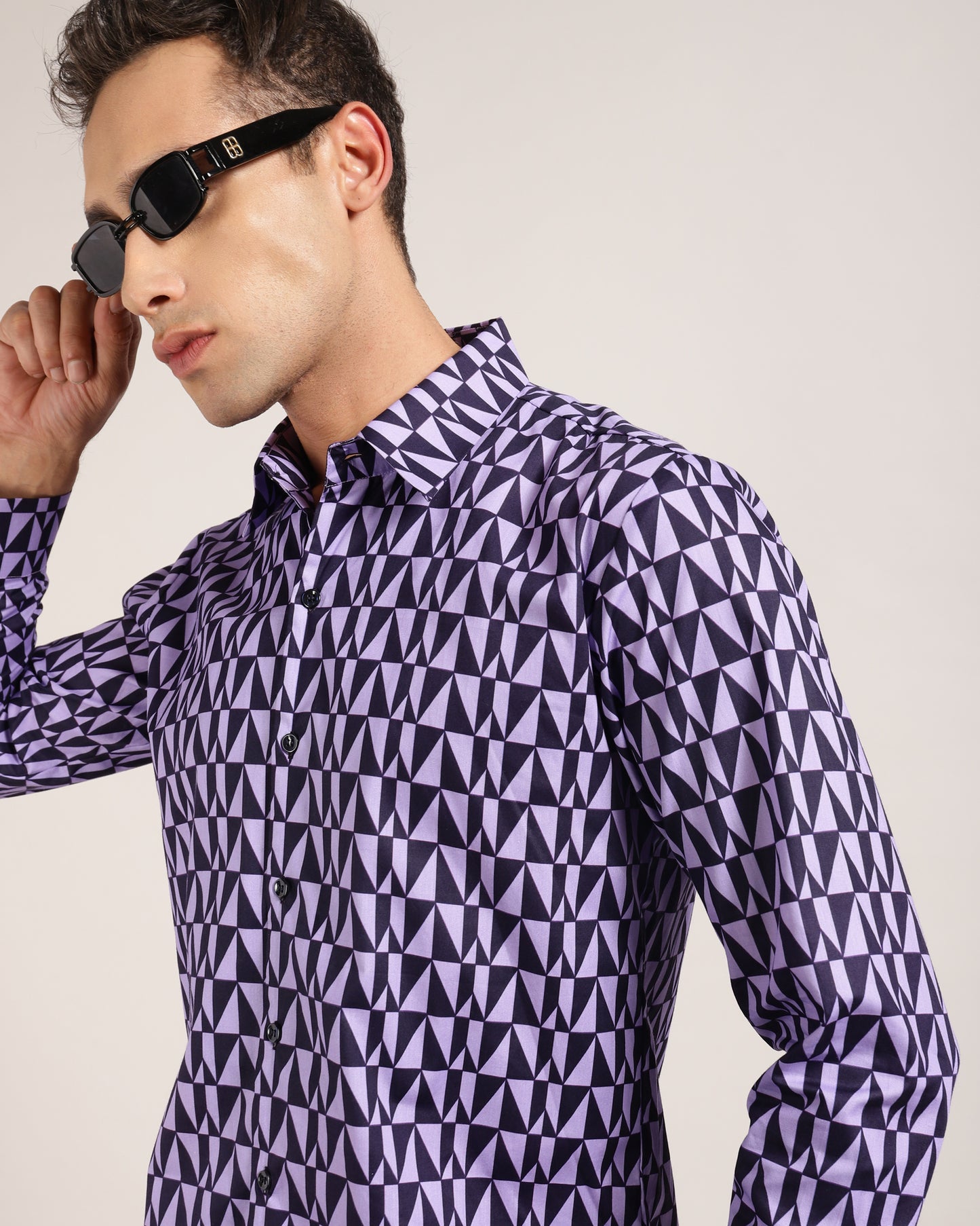 Make a bold statement with the purple and black geometric print shirt by Monsui