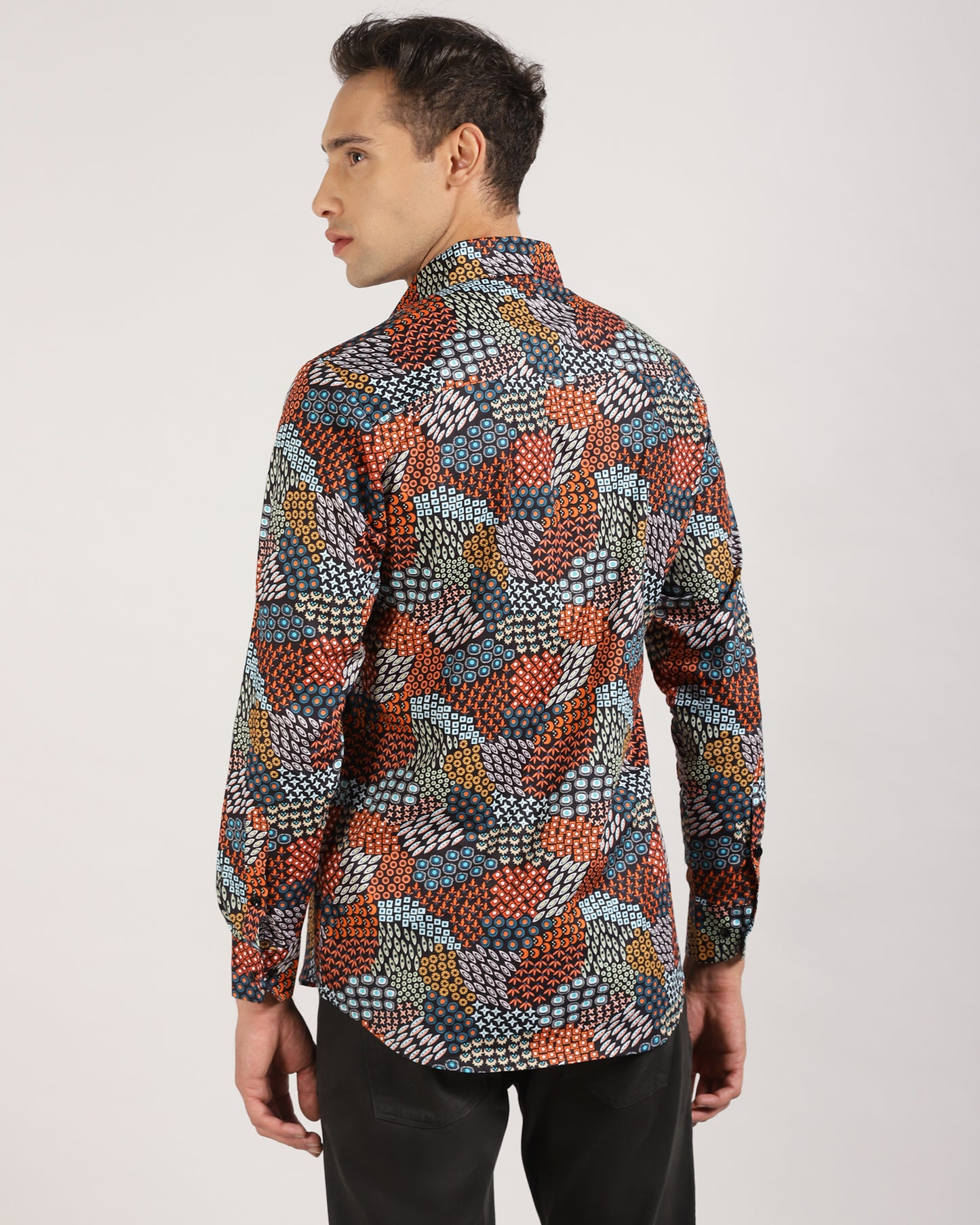 Side view of the multi-color abstract printed shirt, displaying the relaxed fit.