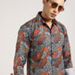 Man wearing the multi-color abstract printed shirt, looking stylish